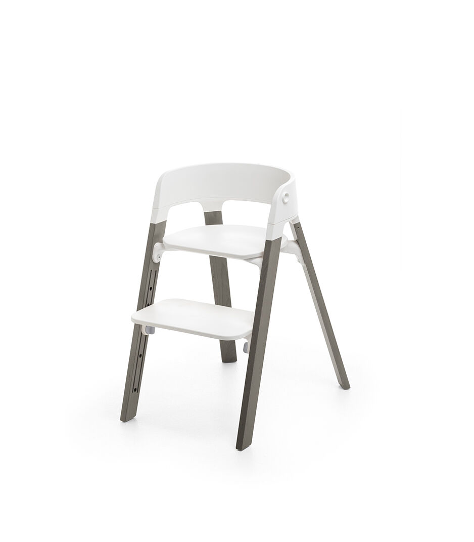 Stokke® Steps™ Hazy Grey  with white seat and footrest in high position.